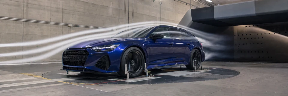 Vehicle undergoing aerodynamic testing in a wind tunnel